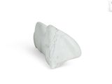 a white marble sculpture on a white surface