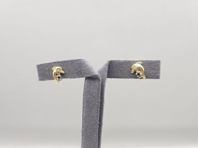 a close up of a pair of earrings on a stand
