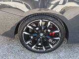 a close up view of a car ' s wheel and tire