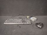 a computer keyboard and mouse on the floor next to a mouse