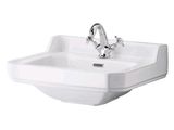 un lavabo blanc avec un robinet chromé et un robinet chromé