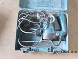 a blue box with tools inside of it on the floor