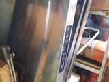 a refrigerator that is sitting in a garage