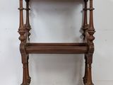 an old wooden shelf with a shelf on top of it