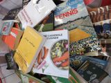 many books that are in a basket on the table