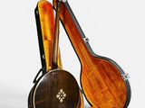 two musical instruments sitting next to each other on a white surface