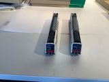 two model trains that are sitting on a table