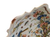 a large bowl with a bird and flowers design on it