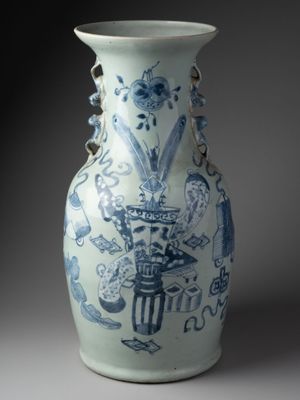 a blue and white vase sitting on a table