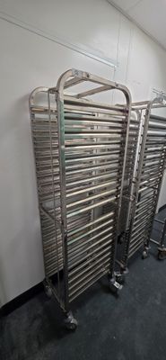 many racks of food that are lined up in a room