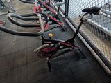 many bikes that are lined up in a bike rack