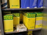many boxes of filters on a shelf in a room