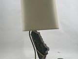 a lamp that is sitting on a table with a lamp on it