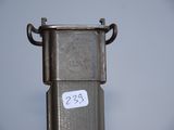 a metal object with a sticker on the side of it
