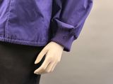 an image of a mannequin wearing a purple jacket and black pants
