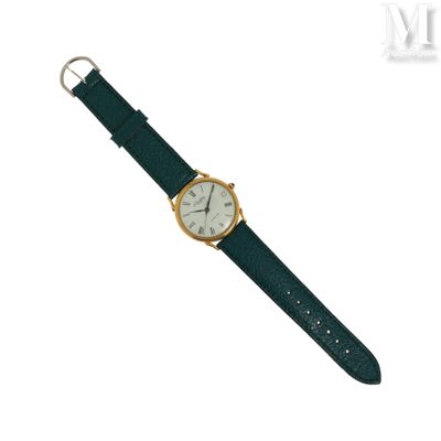 une image représentant une montre en or avec un bracelet vert sur fond blanc