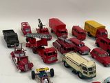 a lot of toy cars and trucks on a white surface