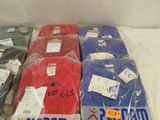 three pairs of plain t - shirts in plastic bags on a table
