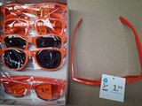 many pairs of sunglasses in a box on the table