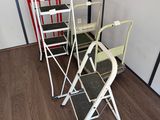 three ladders sitting next to each other in a room