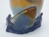 a glass vase with a fish inside of it