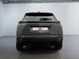 the rear of a grey suv parked in a garage