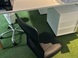 a computer desk with a printer and a printer on it
