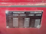 a close up of a red machine with a sign on it
