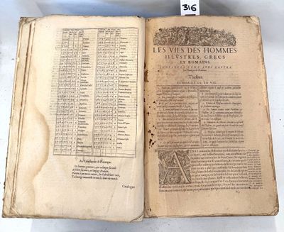 an old book is open on a table with a number of pages on it