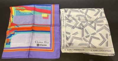 two different colored handkerchiefs on a table with a black background