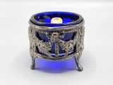 an image of a blue glass candle holder on a white background