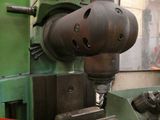 a machine that is working on a piece of metal