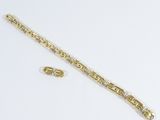 an image of a gold bracelet and earring set on a white surface