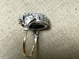 a close up of a silver ring with a horse on it