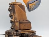 a lamp that is sitting on top of a pile of books