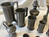 many different types of pewware on a table