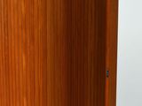 a wooden cabinet with a door open on a white background