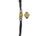 an image of a gold watch and a black strap