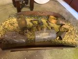 a wooden tray with a lot of old items on it