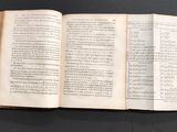 an open book that is sitting on a table