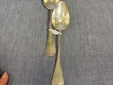 two spoons and a spoon with a tag on them