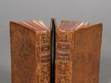 an old book opened to reveal two pages of a book