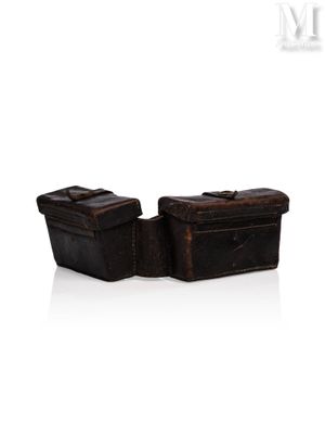 two pieces of luggage sitting next to each other on a white surface