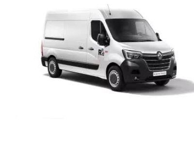 the white van is parked on the side of the road
