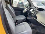 the interior of a small car with a steering wheel and dashboard