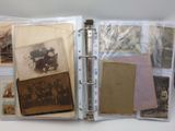 a binder with a bunch of old photos inside of it