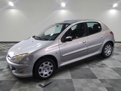 a picture of a silver car parked in a garage