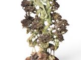an image of a sculpture of a tree on a wooden base