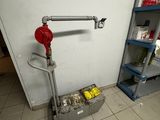 a red fire hydrant in the corner of a room