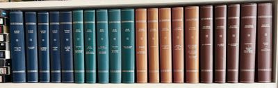 many books that are on a shelf in the room